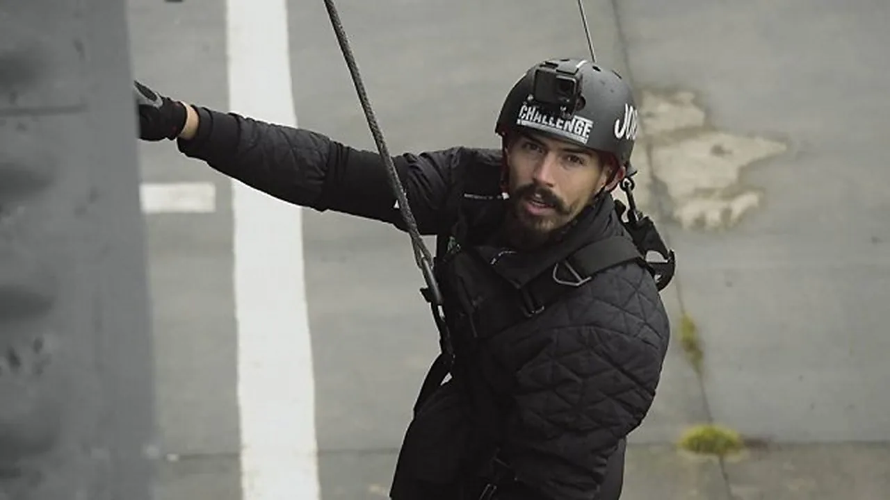 A contestant on a wire in a harness during The Challenge: Total Madness