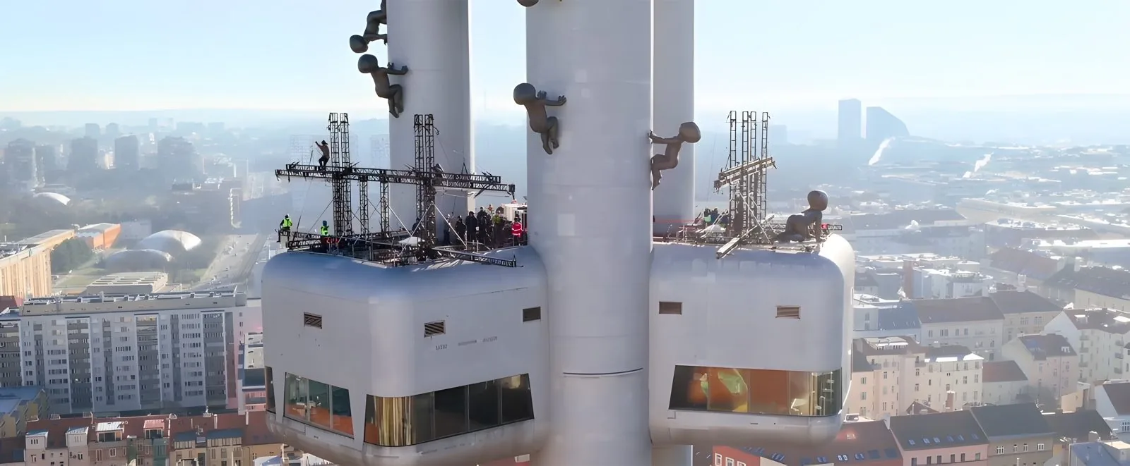 Truss platforms rigged on the pods of a TV tower high above Prague